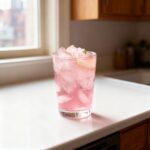Pink Himalayan salt water flush recipe in a glass.
