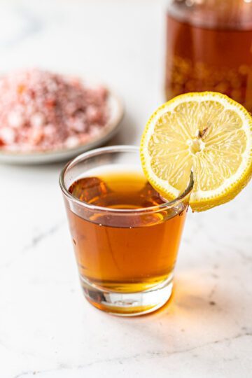 ACV Pink Himalayan Salt detox shot recipe in a clear glass.