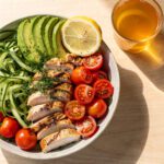 Grilled lemon herb chicken with rice and vegetables for debloating meal