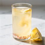 Morning digestive tonic with lemon apple cider vinegar and pink Himalayan salt