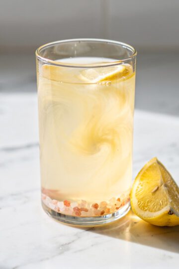 Morning digestive tonic with lemon apple cider vinegar and pink Himalayan salt