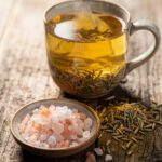 Golden Himalayan pink salt fennel tea for natural bloat relief in a mug