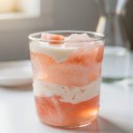 Warm amber Himalayan salt gelatin drink in clear glass mug