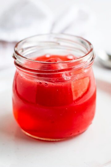Vibrant red bariatric gelatin with salt crystals on marble