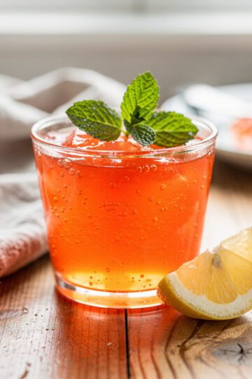Vibrant homemade gelatin dessert with creamy glossy strawberry layers