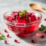 Dr Oz pink gelatin recipe in a glossy ruby red dessert cup