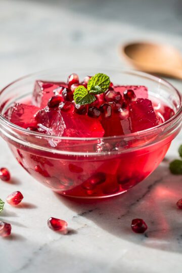 Dr Oz pink gelatin recipe in a glossy ruby red dessert cup