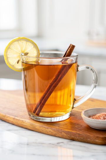 Warm cinnamon tea with lemon in a bright NYC kitchen