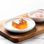 Clear amber gelatin gummy squares with ginger and salt