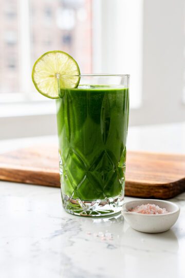 Creamy green smoothie with spinach in bright NYC kitchen