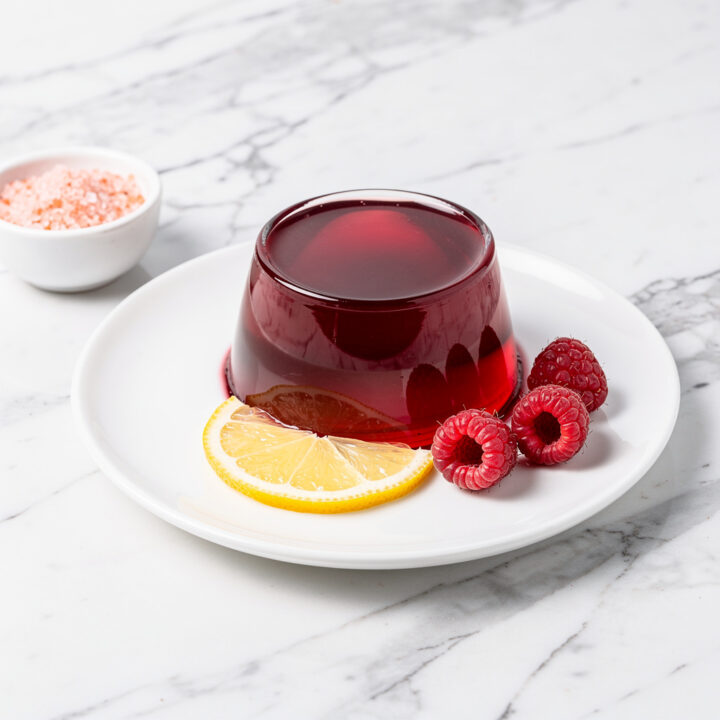 Ruby red hibiscus lemon gelatin with fresh raspberries