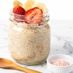 Cold soaked rolled oats chia jar on marble countertop