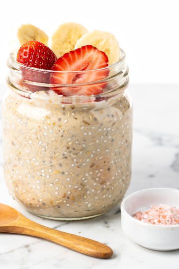 Cold soaked rolled oats chia jar on marble countertop
