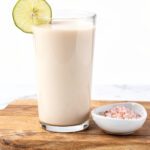Creamy smoothie bowl with oat drink in bright kitchen