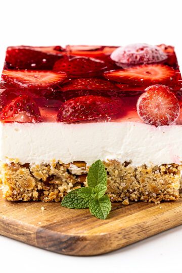 Strawberry pretzel salad layers in clear glass pan